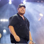 
              FILE - Luke Combs performs during CMA Fest 2022 in Nashville, Tenn., on June 11, 2022. Comb's latest album, "Growin' Up," releases Friday, July 1. (Photo by Amy Harris/Invision/AP, File)
            