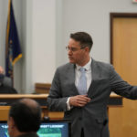 
              Coos County prosecutor John G. McCormick, right, makes an opening statement, Tuesday, July 26, 2022, in the trial for Volodymr Zhukovskyy, of West Springfield, Mass., charged with negligent homicide in the deaths of seven motorcycle club members in a 2019 crash, at Coos County Superior Court, in Lancaster, N.H. Zhukovskyy has pleaded not guilty to multiple counts of negligent homicide, manslaughter, reckless conduct and driving under the influence in the June 21, 2019, crash. (AP Photo/Steven Senne, Pool)
            