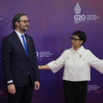 
              Indonesian Foreign Minister Retno Marsudi, right, greets Argentine Foreign Minister Santiago Cafiero upon arrival at the G20 Foreign Ministers' Meeting in Nusa Dua, Bali, Indonesia, Friday, July 8, 2022. (AP Photo/Dita Alangkara, Pool)
            