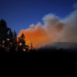 
              In this image released by the National Park Service, smoke from the Washburn Fire rises near the lower portion of the Mariposa Grove in Yosemite National Park, Calif., Thursday, July 7, 2022. Part of Yosemite National Park has been closed as a wildfire quintupled in size near a grove of California's famous giant sequoia trees, officials said. (National Park Service via AP)
            