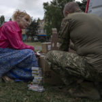 
              Medic volunteer Nataliia Voronkova, left, delivers medical aid to a hospital, in Kurakhove, Donetsk region, eastern Ukraine, Thursday, July 21, 2022. Voronkova has dedicated her life to aid distribution and tactical medical training for soldiers and paramedics, working on front line of the Donetsk region since the war began in 2014. (AP Photo/Nariman El-Mofty)
            