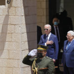 
              U.S. President Joe Biden and Palestinian President Mahmoud Abbas listen to the national anthem during a welcoming ceremony the West Bank town of Bethlehem, Friday, July 15, 2022. (AP Photo/Majdi Mohammed)
            
