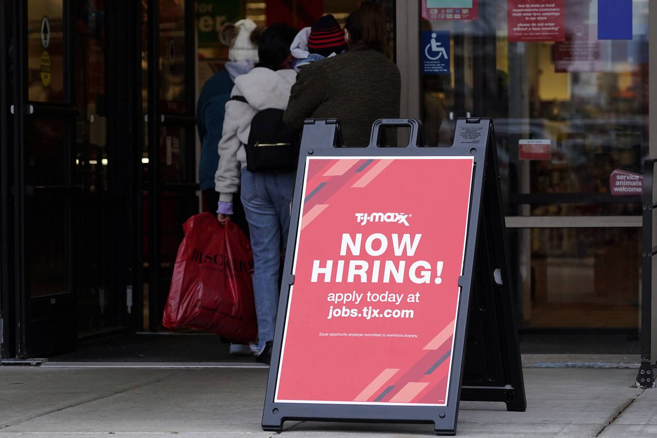FILE - Hiring sign is displayed outside of a retail store in Vernon Hills, Ill., Saturday, Nov. 13,...