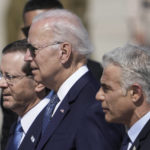 
              President Joe Biden, center, Israeli President Isaac Herzog, left, and Israeli Prime Minister Yair Lapid, walk during a welcoming ceremony after Biden arrived at Ben Gurion Airport, near Tel Aviv, Israel, Wednesday, July 13, 2022. Biden arrives in Israel on Wednesday for a three-day visit, his first as president. He will meet Israeli and Palestinian leaders before continuing on to Saudi Arabia. (AP Photo/Ariel Schalit)
            