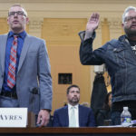 
              Stephen Ayres, who pleaded guilty last in June 2022 to disorderly and disruptive conduct in a restricted building, left, and Jason Van Tatenhove, an ally of Oath Keepers leader Stewart Rhodes, right, are sworn in to testify as the House select committee investigating the Jan. 6 attack on the U.S. Capitol holds a hearing at the Capitol in Washington, Tuesday, July 12, 2022. (AP Photo/Jacquelyn Martin)
            