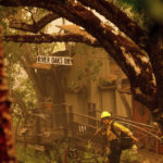 
              A firefighter battling the McKinney Fire protects a cabin in Klamath National Forest, Calif., on Sunday, July 31, 2022. (AP Photo/Noah Berger)
            