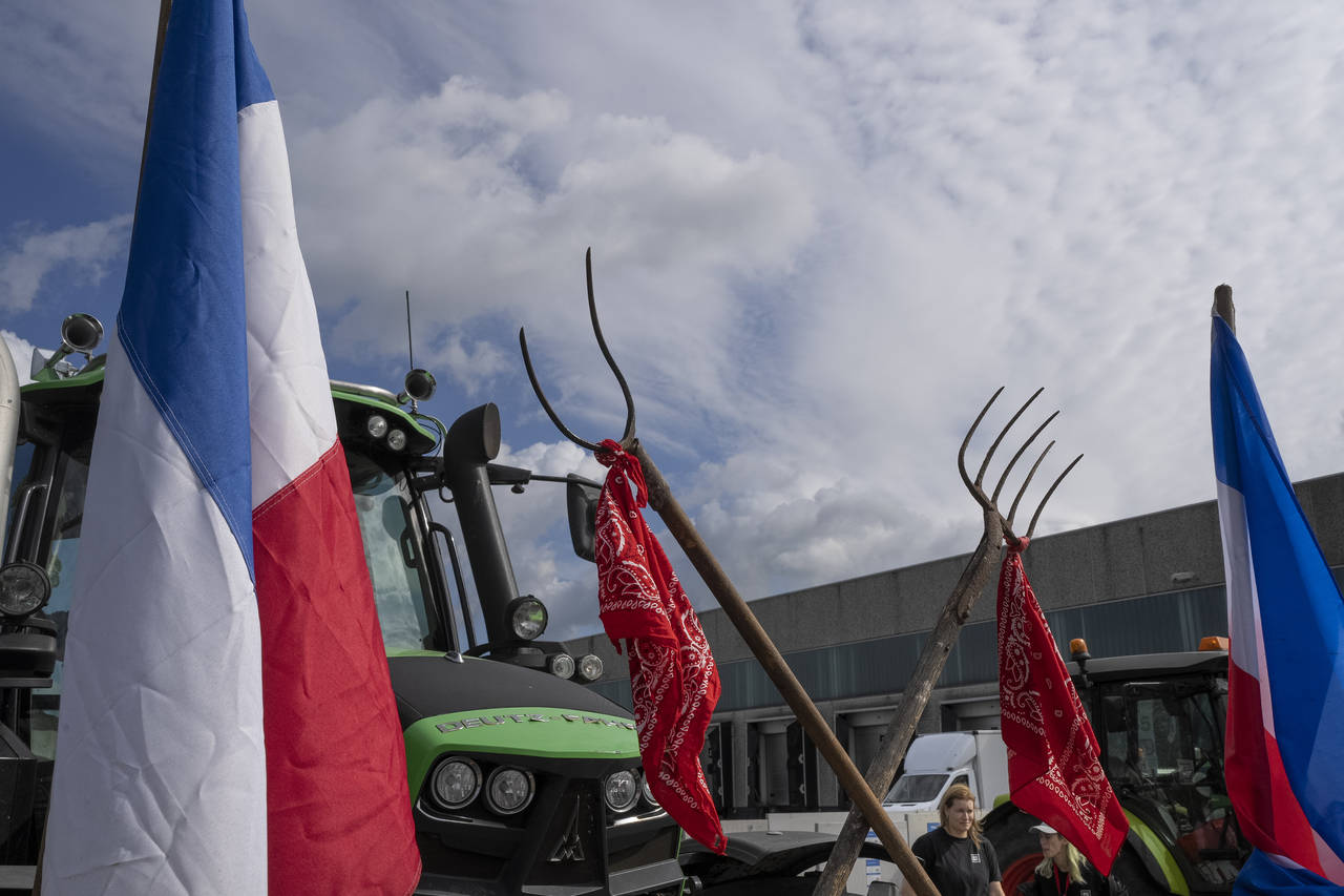 FILE- Some 25 tractors were used to blockade a distribution center for supermarket chain Albert Hei...