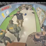 
              FILE - In this photo from surveillance video provided by the Uvalde Consolidated Independent School District via the Austin American-Statesman, authorities respond to the shooting at Robb Elementary School in Uvalde, Texas, Tuesday, May 24, 2022. This week's release of the striking video showing police inaction during the Uvalde school shooting provoked one unexpected response — anger toward the two Texas news outlets, even though their scoop provided what many in the community were seeking. The Austin American-Statesman and KVUE-TV faced complaints of insensitivity toward families of the 19 children and two adults killed by a gunman at Robb elementary school on May 24. (Uvalde Consolidated Independent School District/Austin American-Statesman via AP, File)
            