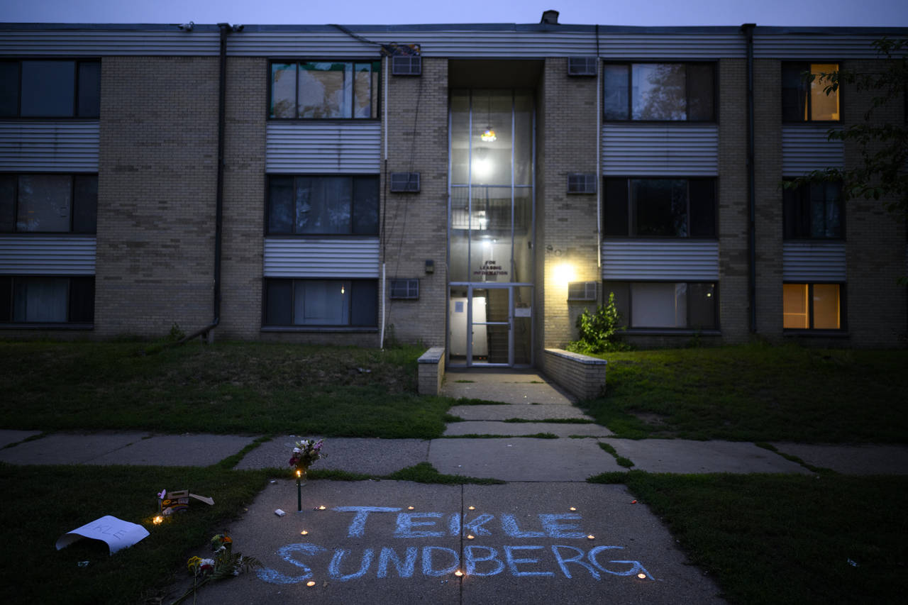Tekle Sundberg's name is written in chalk during a vigil for 20-year old Sundberg Thursday, July 14...