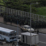 
              Army soldiers stand guard after removing the protesters and their tents from the site of a protest camp outside the Presidential Secretariat in Colombo, Sri Lanka, Friday, July 22, 2022. (AP Photo/Rafiq Maqbool)
            