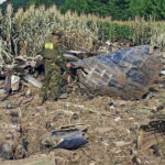 
              In this photo released by the Greek Civil Protection Ministry, a member of a mine clearing team is deployed at the site of crashed Ukrainian cargo plane in Palaiochri village, near the northern city of Kavala, Greece, on Sunday, July 17, 2022. Eight crew members were killed in the crash during the weekend. The Soviet-era plane was transporting Serbian-made mortar ammunition to Bangladesh. (Civil Protection Ministry via AP)
            
