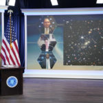
              President Joe Biden listens during a briefing from NASA officials about the first images from the Webb Space Telescope, the highest-resolution images of the infrared universe ever captured, in the South Court Auditorium on the White House complex, Monday, July 11, 2022, in Washington. On screen are NASA Associate Administrator for the Science Mission Directorate Thomas Zurbuchen, top, Deputy Director of the Space Telescope Science Institute (STScI) Nancy Levenson, and NASA James Webb Space Telescope Program Director Greg Robinson, bottom.  (AP Photo/Evan Vucci)
            