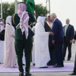 
              President Joe Biden is greeted as he arrives at King Abdulaziz International Airport, Friday, July 15, 2022, in Jeddah, Saudi Arabia. (AP Photo/Evan Vucci)
            