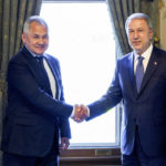 
              In this handout photo released by Russian Defense Ministry Press Service, Russian Defense Minister Sergei Shoigu, left, and Turkish Defense Minister Hulusi Akar shake hands during their meeting in Istanbul, Turkey, Friday, July 22, 2022. U.N. Secretary General Antonio Guterres and Turkish President Recep Tayyip Erdogan were due on Friday to oversee the signing of a key agreement that would allow Ukraine to resume its shipment of grain from the Black Sea to world markets and for Russia to export grain and fertilizers, ending a standoff that has threatened world food security. (Vadim Savitsky, Russian Defense Ministry Press Service via AP)
            