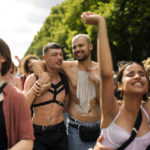 
              Revelers dance as they take part in the annual pride march in Berlin, Germany, Saturday, July 23, 2022. Draped in rainbow flags, around 150,000 people were marching for LGBTQ rights at Berlin's annual Christopher Street Day celebration. Berlin police gave the crowd estimate on Saturday afternoon but said the number could grow into the evening. (AP Photo/Markus Schreiber)
            