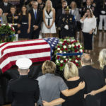 
              Medal of Honor recipients and family members surround the flag-draped casket bearing the remains of Hershel W. "Woody" Williams lies in honor in the U.S. Capitol, Thursday, July 14, 2022 in Washington. Williams, the last remaining Medal of Honor recipient from World War II, died at age 98. (AP Photo/Alex Brandon, Pool)
            