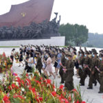 
              In this photo provided by the North Korean government, people and military personnel visit the statues of former North Korean leaders Kim Il Sung and Kim Jong Il on Mansu Hill in Pyongyang, North Korea, Wednesday, July 27, 2022, on the occasion of the 69th anniversary of the end of the Korean War. Independent journalists were not given access to cover the event depicted in this image distributed by the North Korean government. The content of this image is as provided and cannot be independently verified. Korean language watermark on image as provided by source reads: "KCNA" which is the abbreviation for Korean Central News Agency. (Korean Central News Agency/Korea News Service via AP)
            