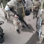 
              FILE - Two injured Russian soldiers, left and right, arrive at a hospital to be treated on March 10, 2022, in Mariupol, Ukraine. "They will not be as kind to us as we'll be to them," Yuliia Paievska, known as Taira, says about treating the soldiers. "But I couldn't do otherwise. They are prisoners of war." (Yuliia Paievska via AP, File)
            