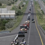 
              CORRECTS DATE TO SUNDAY, JULY 17,  2022, NOT MONDAY, JULY 18 2022 - A procession carrying the four victims of a Bernalillo County Sheriff Office helicopter crash heads south on Interstate 25., Sunday, July 17, 2022, near Las Vegas, N.M., about 123 miles (197 kilometers) northeast of Albuquerque. (Adolphe Pierre-Louis/The Albuquerque Journal via AP)
            