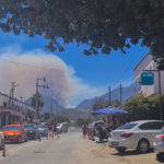 
              In this image from video, smoke rises from a wild fire in the mountains close to Mesudiye village, Turkey, Wednesday, July 13, 2022. A wildfire, stoked by strong winds, forced authorities on Wednesday to evacuate a number of homes near a resort in southwestern Turkey, officials said. (AP Photo/Oguzhan Arslan)
            