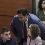 
              Marjory Stoneman Douglas High School shooter Nikolas Cruz speaks with Chief Assistant Public Defender David Wheeler and Assistant Public Defender Tamara Curtis during jury selection in the penalty phase of his trial at the Broward County Courthouse in Fort Lauderdale, Fla., on Wednesday, June 29, 2022.  A jury of seven men and five women have been sworn in for the penalty trial of Cruz. The final selections were made Wednesday with the defense using its final strikes to eliminate a banking executive and retired insurance executive who had tentatively been accepted Tuesday. (Amy Beth Bennett/South Florida Sun-Sentinel via AP, Pool)
            