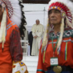 
              Pope Francis arrives for a meeting with indigenous communities, including First Nations, Metis and Inuit, at Our Lady of Seven Sorrows Catholic Church in Maskwacis, near Edmonton, Canada, Monday, July 25, 2022. Pope Francis begins a "penitential" visit to Canada to beg forgiveness from survivors of the country's residential schools, where Catholic missionaries contributed to the "cultural genocide" of generations of Indigenous children by trying to stamp out their languages, cultures and traditions. Francis set to visit the cemetery at the former residential school in Maskwacis. (AP Photo/Gregorio Borgia)
            