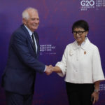 
              Indonesian Foreign Minister Retno Marsudi, right, greets European Union High Representative for Foreign Affairs and Security Policy Josep Borrell Fontelles upon arrival at the G20 Foreign Ministers' Meeting in Nusa Dua, Bali, Indonesia, Friday, July 8, 2022. (AP Photo/Dita Alangkara, Pool)
            