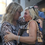 
              Paola Vicini, right, and Maria Grazia Lonigro, mothers of Mirko Vicini and Luigi Matti Altadonna, two of the 43 victims, greet each other outside the Genoa's Palace of Justice on opening of the first hearing of the trial for the Morandi bridge collapse,Thursday, July 7, 2022. Forty-three people were killed when a large stretch of the Morandi Bridge broke off, August 14, 2018, on the eve of one of Italy's biggest vacation holidays. (AP Photo/Antonio Calanni)
            