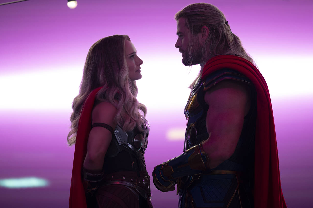This image released by Marvel Studios shows Natalie Portman, left, and Chris Hemsworth in a scene f...