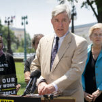 
              FILE - Sen. Sheldon Whitehouse, D-R.I., and Sen. Elizabeth Warren, D-Mass., right, members of the Senate Committee on Finance, are joined by activists as they talk to reporters about corporate price gouging during this period of inflation, at the Capitol in Washington, July 14, 2022. Whitehouse suggested a series of actions President Joe Biden could take to address climate change, including “a robust social cost of carbon rule″ that would force energy producers to account for greenhouse gas emissions as a cost of doing business. (AP Photo/J. Scott Applewhite, File)
            