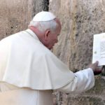 
              FILE - Pope John Paul II places a typed and signed note into a crack at the Western Wall Sunday, March 26, 2000, in Jerusalem's Old City. He tucked the prayer note into the wall asking God’s forgiveness for those who "have caused these children of yours to suffer.” (Gabriel Bouys/Pool Photo via AP, File)
            