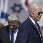 
              President Joe Biden, right, and Israeli Prime Minister Yair Lapid, participate in an arrival ceremony after Biden arrived at Ben Gurion Airport, near Tel Aviv, Israel, Wednesday, July 13, 2022. Biden arrives in Israel on Wednesday for a three-day visit, his first as president. He will meet Israeli and Palestinian leaders before continuing on to Saudi Arabia. (AP Photo/Ariel Schalit)
            