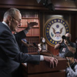 
              Senate Majority Leader Chuck Schumer, D-N.Y., talks to reporters about the agreement reached with Sen. Joe Manchin, D-W.Va., that they had sought for months on health care, energy and climate issues, taxes on higher earners and corporations, at the Capitol in Washington, Thursday, July 28, 2022. (AP Photo/J. Scott Applewhite)
            