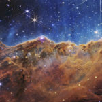 
              This image released by NASA on Tuesday, July 12, 2022, shows the edge of a nearby, young, star-forming region NGC 3324 in the Carina Nebula. Captured in infrared light by the Near-Infrared Camera (NIRCam) on the James Webb Space Telescope, this image reveals previously obscured areas of star birth, according to NASA. (NASA, ESA, CSA, and STScI via AP)
            
