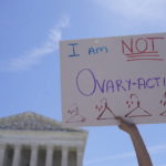 
              FILE - An abortion-rights activist holds a sign reading "I am not Ovary-Acting," during a protest outside of the U.S. Supreme Court, on June 28, 2022, in Washington. A new poll finds a growing percentage of Americans calling out abortion or women’s rights as priorities for the government in the wake of the Supreme Court’s decision to overturn Roe v. Wade, especially among Democrats and those who support abortion access. (AP Photo/Mariam Zuhaib, File)
            