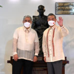 
              Philippine Foreign Affairs Secretary Enrique Manalo, left, and Chinese Foreign Minister Wang Yi pose for a photo before their bilateral talks at the Department of Foreign Affairs in Manila, Philippines on Wednesday, July 6, 2022. (Jam Sta Rosa/Pool Photo via AP)
            