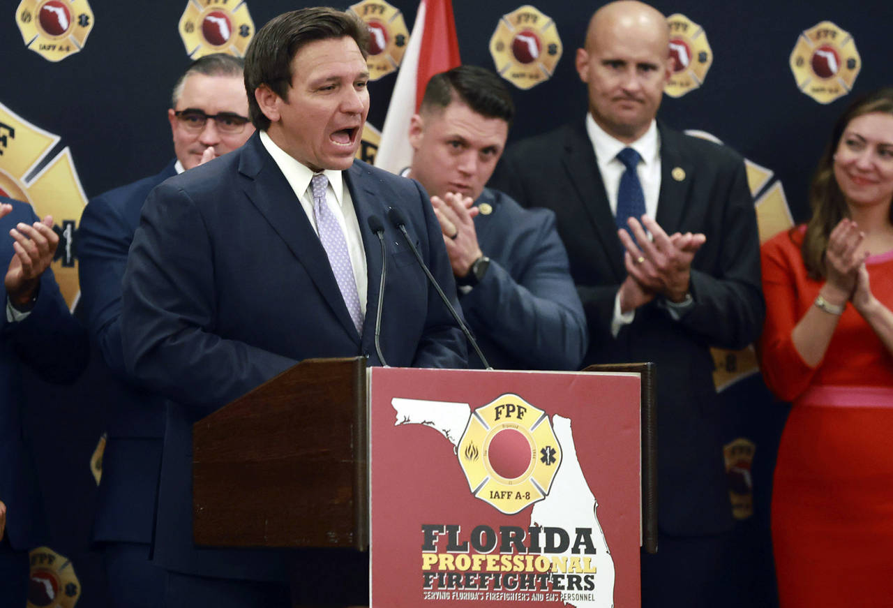 Florida Gov. Ron DeSantis speaks to the applause of firefighters as he accepts the endorsement of t...