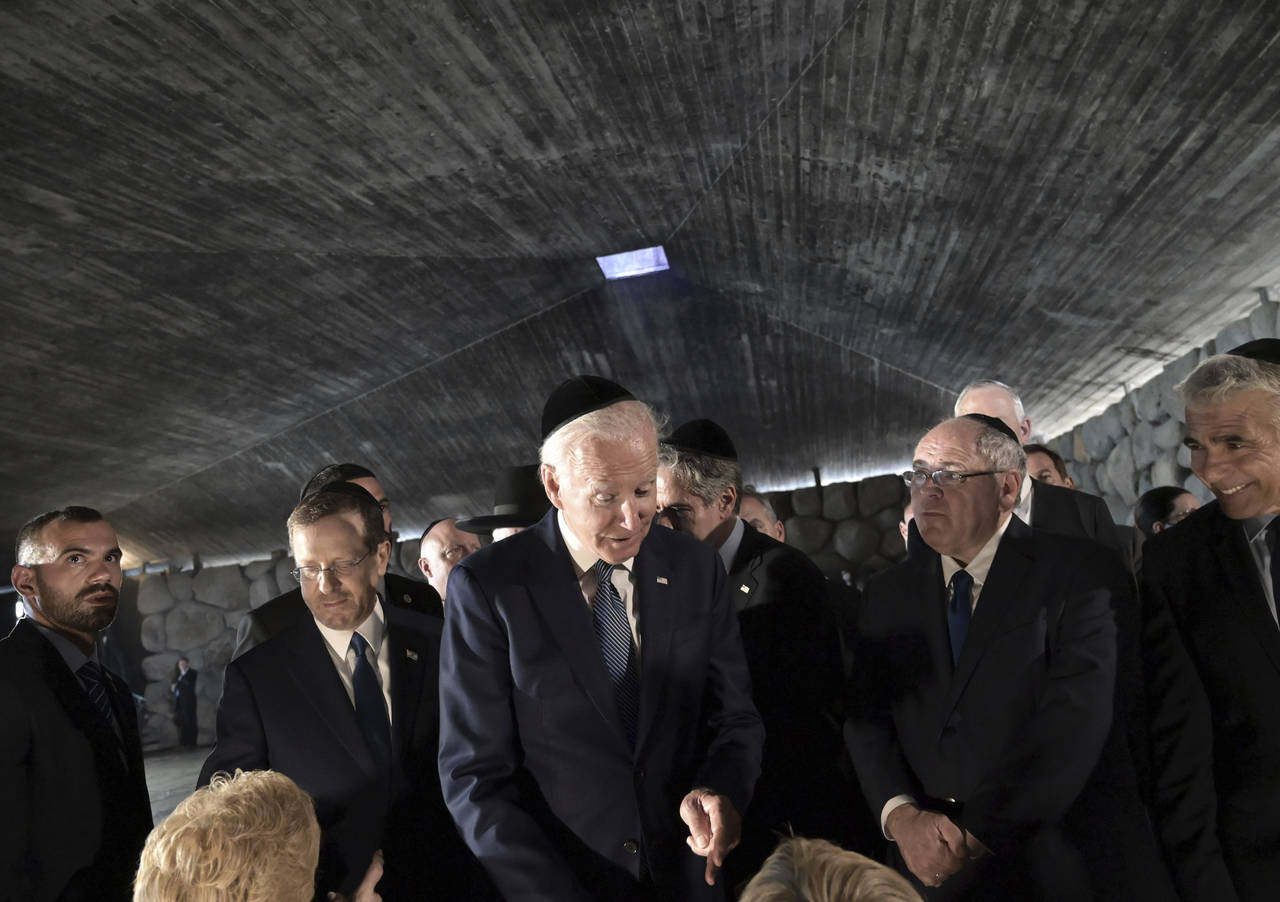 President Joe Biden greets Holocaust survivors Giselle Cycowicz and Rena Quint at the Hall of Remem...