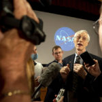 
              In this image released by NASA, NASA James Webb Space Telescope Senior Project Scientist John Mather speaks with members of the media following the release of the first full-color images from the James Webb Space Telescope, Tuesday, July 12, 2022, at NASA's Goddard Space Flight Center in Greenbelt, Md. (Taylor Mickal/NASA via AP)
            