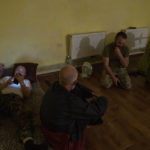 
              Ukrainian Muslim soldiers sit in a bomb shelter after hearing and feeling the effect of shelling near by, inside the Medina Mosque, Konstantinovka, eastern Ukraine, Saturday, July 9, 2022. (AP Photo/Nariman El-Mofty)
            