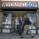 
              Two men walk in front of the Wyoming Republican Party headquarters in Cheyenne, Wyo., on Tuesday, July 19, 2022. Rep. Liz Cheney, Wyoming's congresswoman since 2016. is facing a Donald Trump-backed opponent, attorney Harriet Hageman, in the state's upcoming Republican primary. (AP Photo/Thomas Peipert)
            