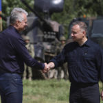 
              Polish President Andrzej Duda, right, and Lithuania's President Gitanas Nauseda, left, shake hands after a press conference, near Szypliszki, Poland, Thursday, July 7, 2022. The presidents of NATO members Poland, Andrzej Duda, and Lithuania, Gitanas Nauseda, voiced confidence Thursday that allied troops can fully safeguard a strategically vital corridor, which links their countries, between Russian ally Belarus and a Russian Baltic Sea exclave. (AP Photo/Michal Dyjuk)
            