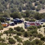 
              CORRECTS DATE TO SUNDAY, JULY 17,  2022, NOT MONDAY, JULY 18, 2022 - Investigators and first responders gather at a helicopter crash site, Sunday, July 17, 2022, near Las Vegas, N.M., about 123 miles (197 kilometers) northeast of Albuquerque. Four people have been killed in a crash of a Bernalillo County Sheriff’s Office helicopter that was headed back to Albuquerque after assisting firefighters in another New Mexico city, authorities said. (Adolphe Pierre-Louis/The Albuquerque Journal via AP)
            
