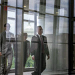 
              Pat Cipollone, right, the former White House counsel under President Donald Trump, walks to a conference room for a break from an interview room in the Ford House Office Building while answering questions from investigators with the Jan. 6 Select Committee, on Capitol Hill in Washington, Friday, July 8, 2022. The U.S. Capitol is seen behind. (AP Photo/Gemunu Amarasinghe)
            