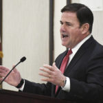 
              FILE - Arizona Gov. Doug Ducey re-delivers his State of the State address in front of a Yuma, Ariz., crowd, Feb. 17, 2022, inside Pivot Point Conference Center. Ducey has endorsed businesswoman Karrin Taylor Robson to be his successor. Ducey on Thursday added his name to a growing list of mainstream conservatives looking to boost the businesswoman past Donald Trump-endorsed frontrunner Kari Lake.  (Randy Hoeft/The Yuma Sun via AP, File)
            