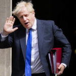 
              British Prime Minister Boris Johnson gestures as he leaves 10 Downing Street in London, Wednesday, July 6, 2022. A defiant British Prime Minister Boris Johnson is battling to stay in power after his government was rocked by the resignation of two top ministers. His first challenge is getting through Wednesday, where he faces tough questions at the weekly Prime Minister's Questions session in Parliament, and a long-scheduled grilling by a committee of senior lawmakers. (AP Photo/Frank Augstein)
            