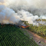 
              This photo provided by the fire brigade of the Gironde region (SDIS33) shows a wildfire near Landiras, southwestern France, Wednesday, July 13, 2022. A spate of wildfires is scorching parts of Europe, with firefighters battling blazes in Portugal, Spain and southern France on Wednesday amid an unusual heat wave that authorities are linking to climate change. (SDIS33 via AP)
            