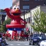 
              Sesame Street's Elmo float is carried through the Pittsfield Fourth of July parade in Pittsfield, Mass., on Monday, July, 4, 2022. (Gillian L. Jones/The Berkshire Eagle via AP)
            