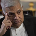 
              FILE - Sri Lanka's new Prime Minister Ranil Wickremesinghe gestures during an interview with The Associated Press in Colombo, Sri Lanka, Saturday, June 11, 2022. Sri Lankan President Ranil Wickremesinghe said Saturday, July 30, that an agreement with the International Monetary Fund to help pull the bankrupt nation out of its economic crisis is pushed back to September because of unrest over the past weeks. Wickremesinghe was elected president on July 20. (AP Photo/Eranga Jayawardena, File)
            