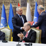 
              In this handout photo released by Russian Defense Ministry Press Service, Turkish President Recep Tayyip Erdogan, right, and U.N. Secretary General, Antonio Guterres, sit as Russian Defense Minister Sergei Shoigu, top left, and Turkish Defense Minister Hulusi Akar, top right, exchange documents during a signing ceremony at Dolmabahce Palace in Istanbul, Turkey, Friday, July 22, 2022. U.N. Secretary General Guterres and Turkish President Erdogan were due on Friday to oversee the signing of a key agreement that would allow Ukraine to resume its shipment of grain from the Black Sea to world markets and for Russia to export grain and fertilizers, ending a standoff that has threatened world food security. (Vadim Savitsky, Russian Defense Ministry Press Service via AP)
            